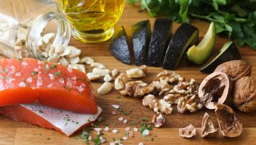 Omega 3 healthy fats food salmon avocado on butchers block