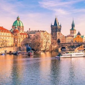 Panorama of Prague city, the capital of Czech Republic, with the Vltava river, the Charles Bridge and  surrounding buildings, on a sunny day of March.