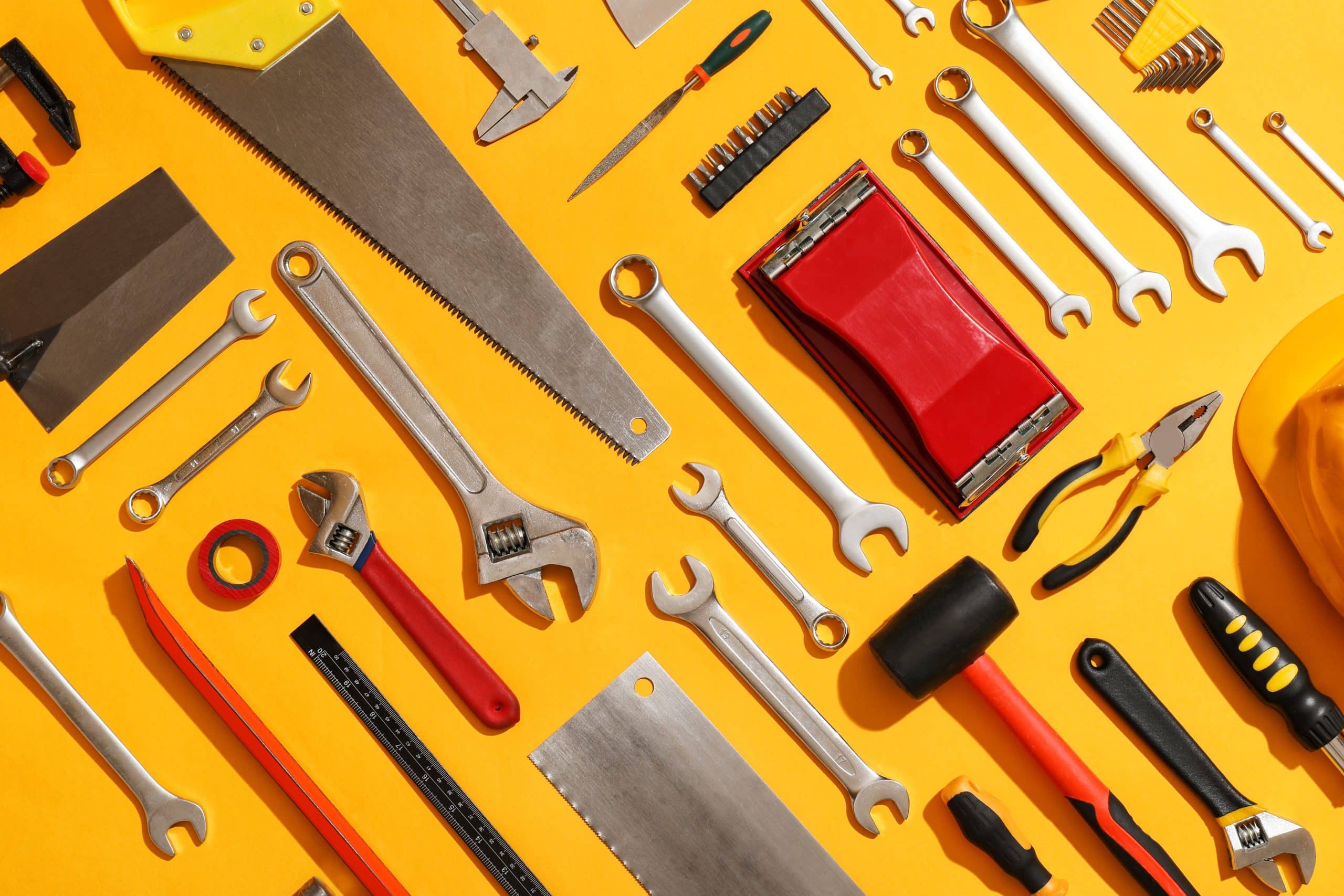 Set of construction tools on color background