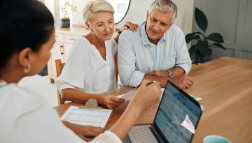 Financial advisor consultation with clients on retirement, finance planning or investment and document on laptop screen. Accountant woman, senior people and pension advice, asset management or budget
