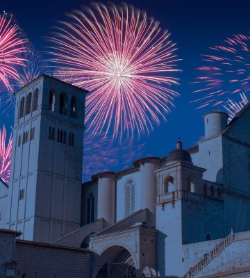 Celebratory fireworks for new year over Saint Francesco  of Assi