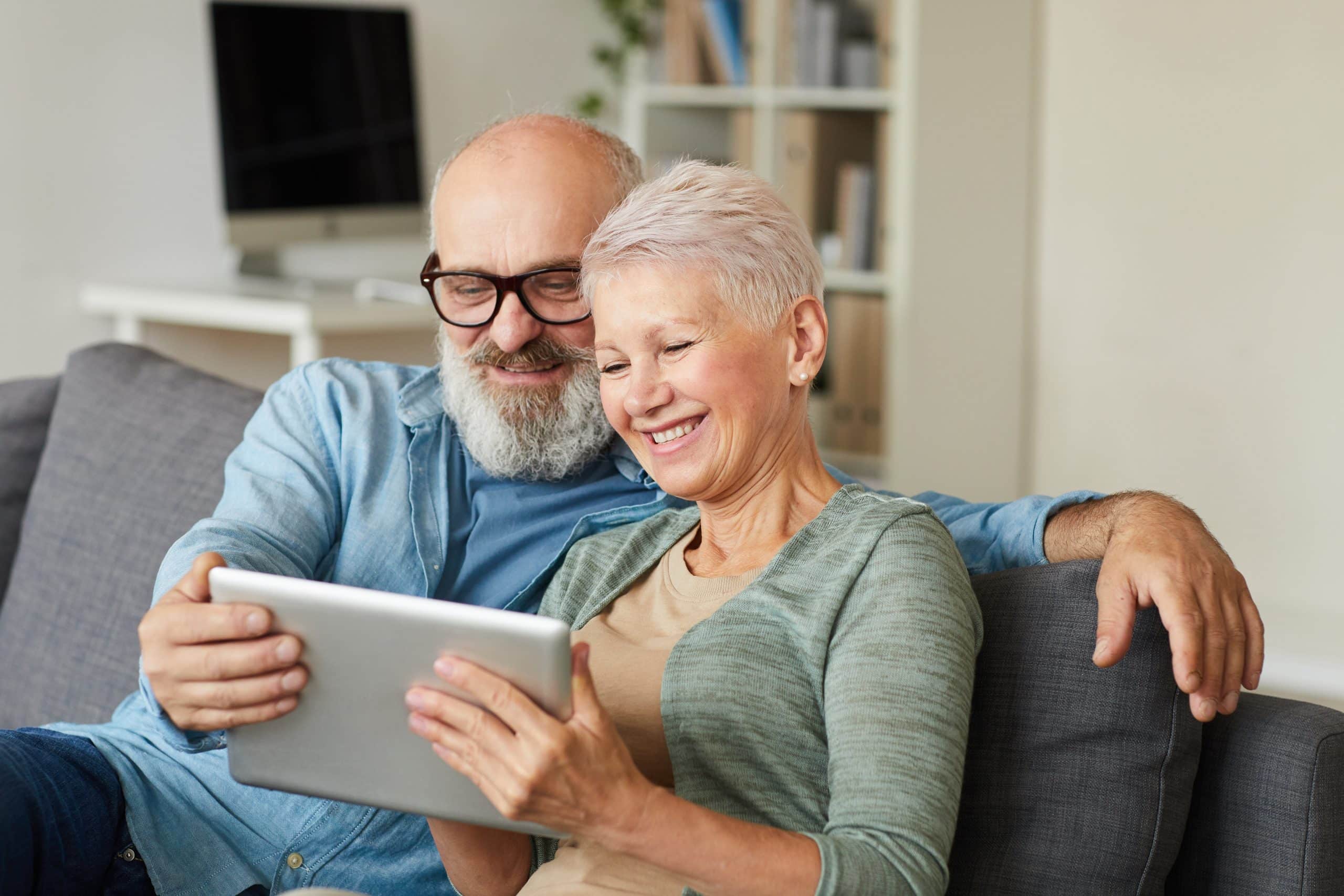 Senior couple using tablet pc